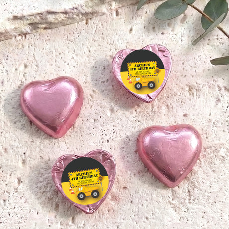 Pink foil chocolate heart with 'Archie's 4th Birthday' label