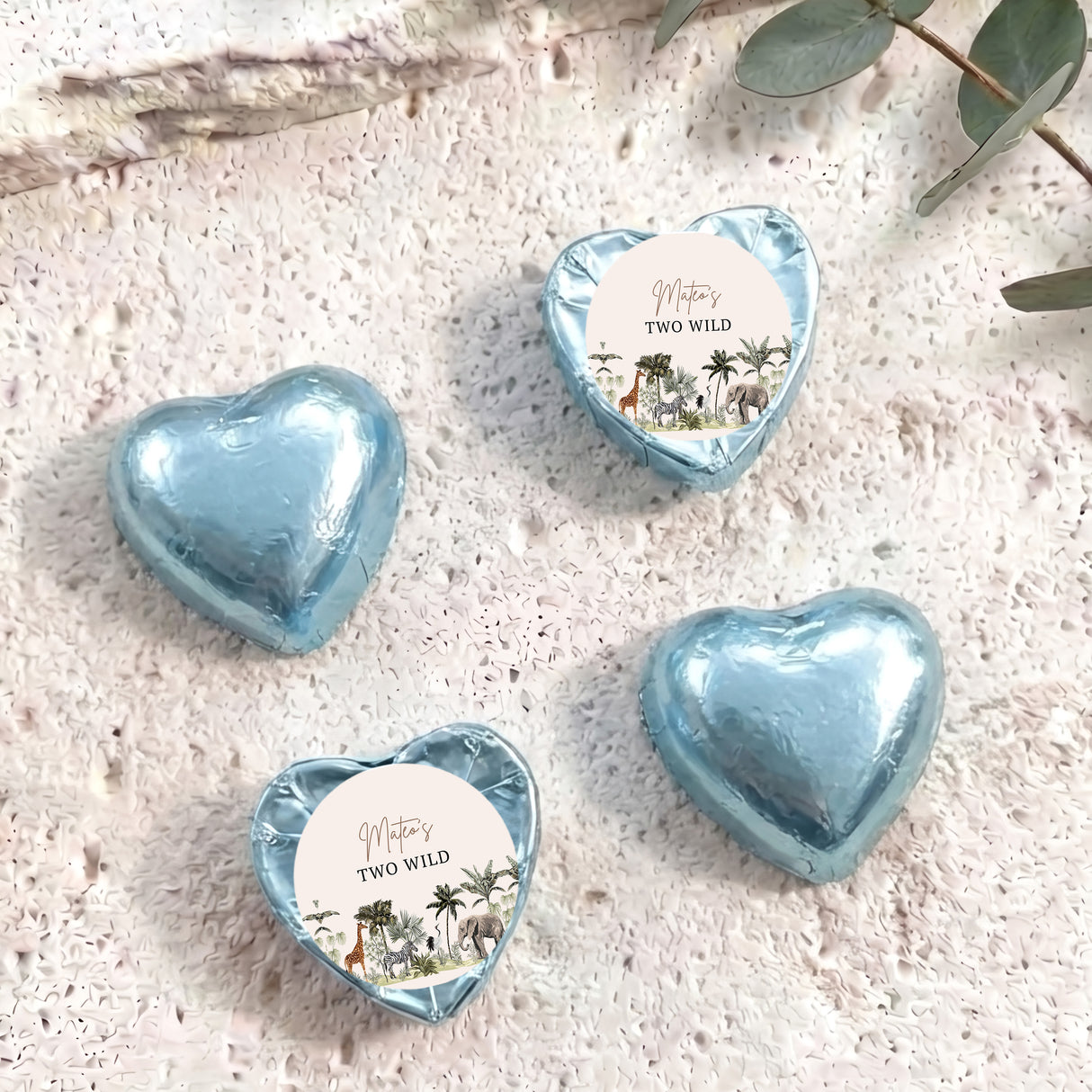 Light blue foil chocolate hearts with “Two Wild” personalised round label