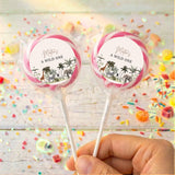 Personalised jungle-themed lollipops with pink border, round label reading 'A wild one'.