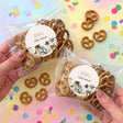 Personalised pretzel bag set in clear plastic with round label and pretzels
