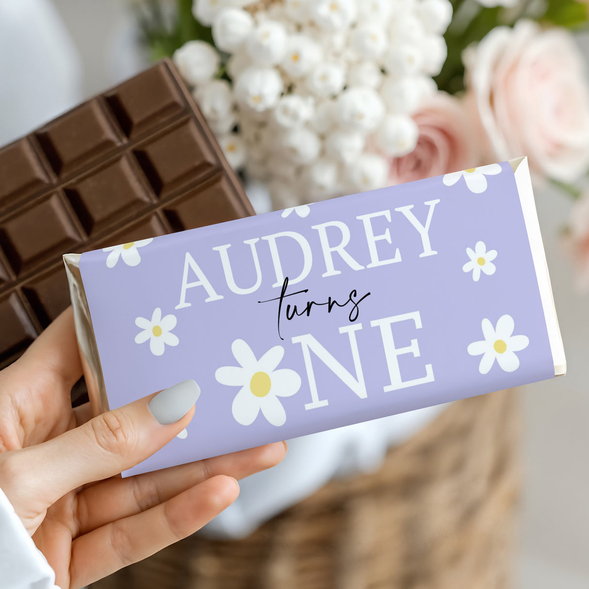 Purple birthday chocolate bar wrapper with Audrey turning ONE and daisy pattern