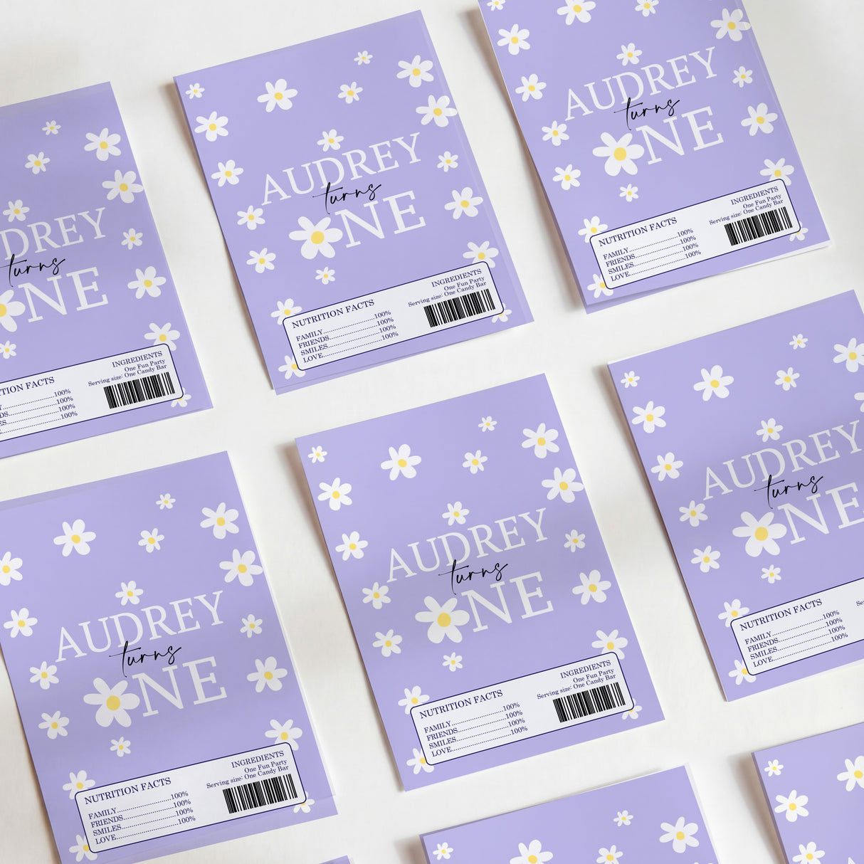 Purple birthday chocolate wrappers with daisy pattern and "Audrey One" text
