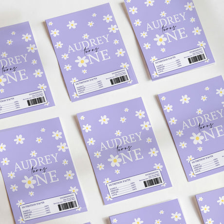 Purple birthday chocolate wrappers with daisy pattern and "Audrey One" text