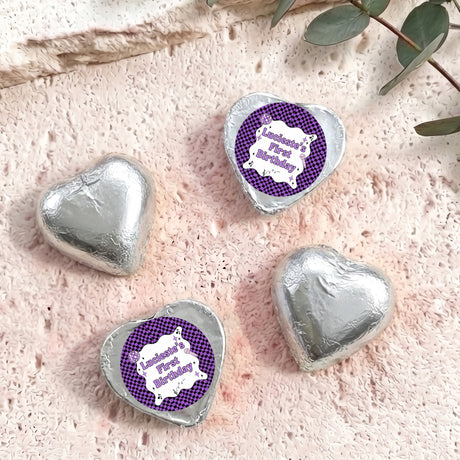 Silver foil-covered chocolate hearts with purple check birthday label