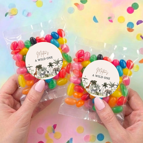 Two personalised jelly bean bags with jungle-themed circular labels in clear wrappers