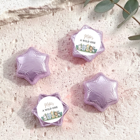 Lavender foil star chocolates with “A WILD ONE” label