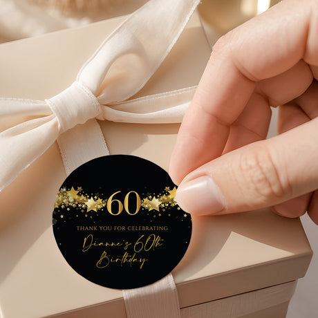 Round black-and-gold 60th birthday thank-you label with gold stars and “60”