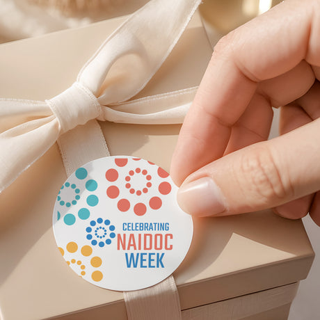 Round pastel dot printed label: 'Celebrating NAIDOC Week'