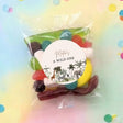Party mix lolly bag with clear wrapper and round 'A Wild One' jungle label