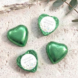 Personalised foil-covered chocolate heart favours in green foil, with printed thank-you labels