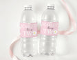 Clear plastic water bottles with pink daisy birthday labels: 'Scarlet turns TW'
