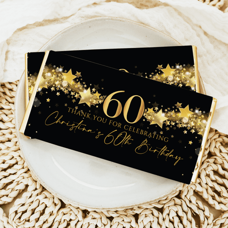 60th birthday chocolate bar, black wrapper with gold stars and "Thank you for celebrating"