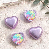Purple foil heart chocolates with tie-dye personalized print; three hearts shown
