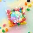 Kids tie-dye birthday jelly bean bag with round personalized label, assorted candy beans