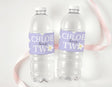 Purple daisy personalised water bottle labels wrapped around two clear bottles