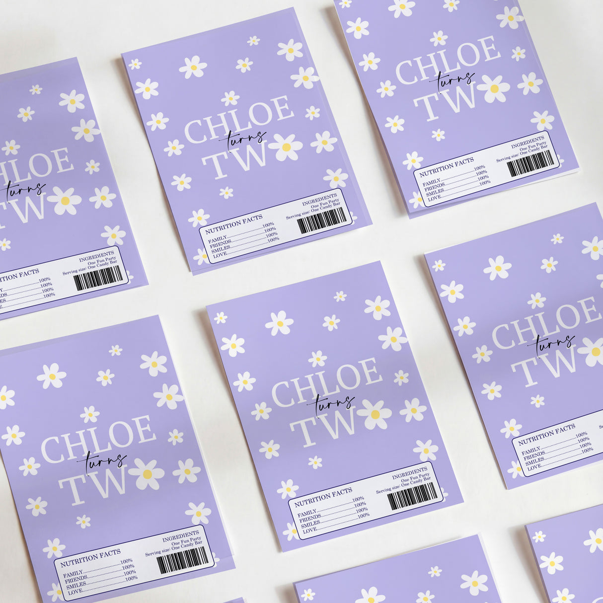 Purple daisy printed chocolate wrappers with 'CHLOE TW' text and barcode