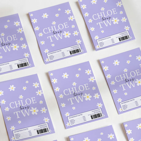 Purple daisy printed chocolate wrappers with 'CHLOE TW' text and barcode