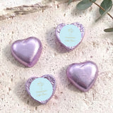Foil-covered chocolate heart sweets in lavender, with cross and name text.