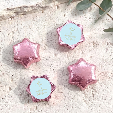 Pink foil-covered chocolate star sweets with cross label, personalised for First Holy Communion