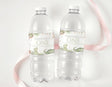 Personalised dinosaur first birthday water bottle labels with “ONE” on clear bottles