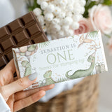 Custom dinosaur-themed chocolate bar with white wrapper and "ONE" birthday text