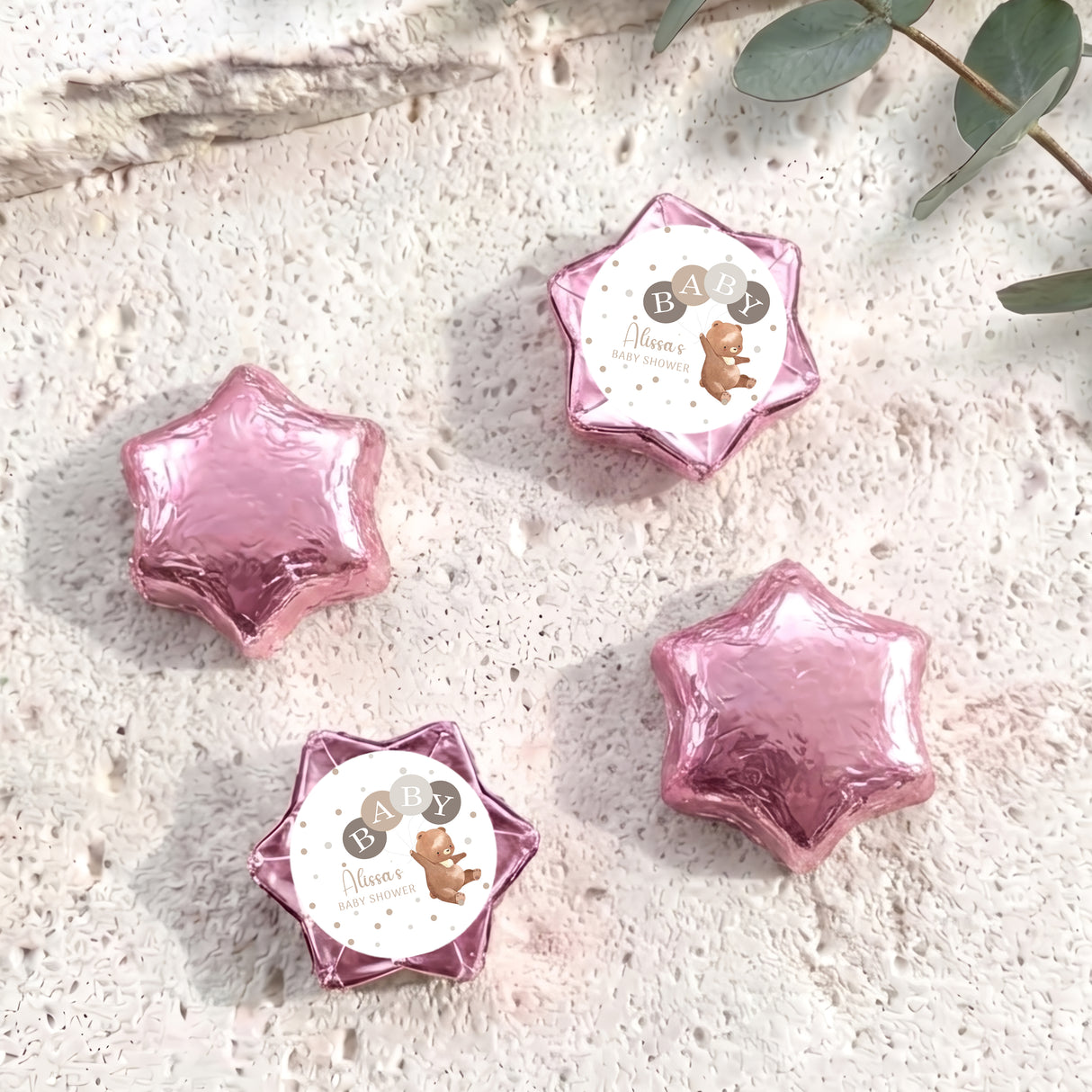 Pink star foil balloons with round baby shower label and bear design
