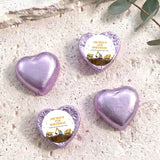 Foil-covered chocolate hearts in lilac with birthday label featuring a construction truck