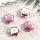 Foil-covered chocolate star sweets in pink, with birthday foil label