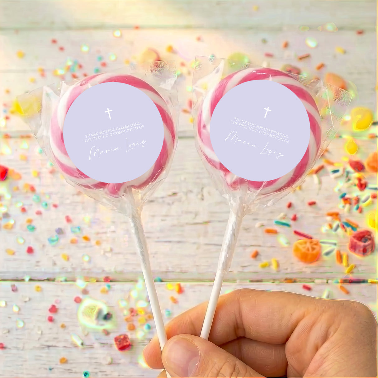 Personalised First Holy Communion lollipops with pink ribbons and cross labels