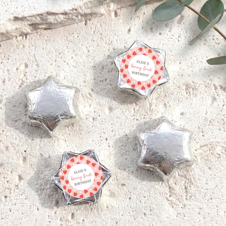Foil-covered star chocolates in silver with a personalized birthday label on one