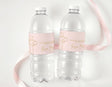 Personalised baptism water bottle labels on two clear bottles with pink cross design