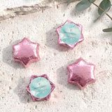 Foil-covered pink chocolate stars with white cross and personalised message card