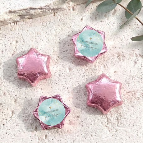 Pink foil star chocolates with cross label, set of four foil-wrapped stars