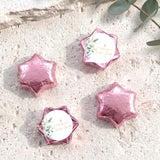 Foil-wrapped chocolate stars in pink with gold cross, set of four