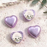 Purple foil-covered chocolate hearts with white 'A WILD ONE' label