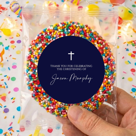 Navy cross christening card with round navy center and confetti beads around it