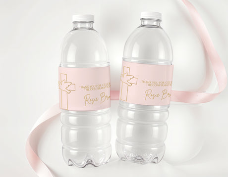 Personalised water bottle labels with pale pink cross design on two clear bottles