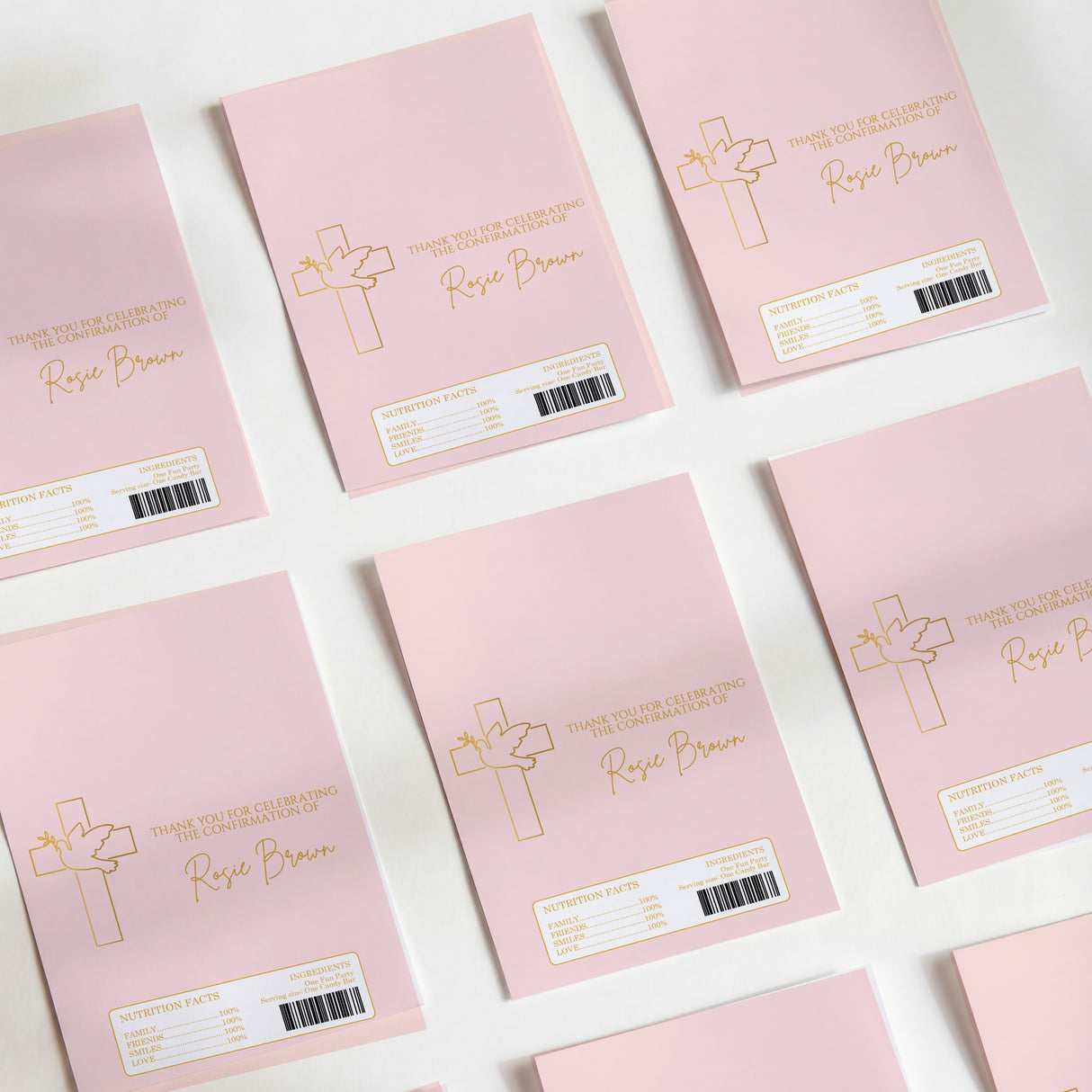 Pink DIY printed chocolate wrappers with cross design, text, and barcode labels