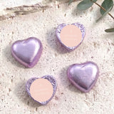 Purple foil heart chocolates with cross and personalised text on pale label.