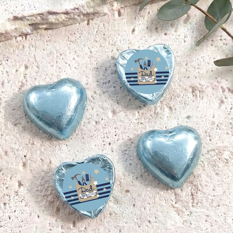 Light blue foil-covered chocolate heart chocolates with “Dad” label on each