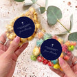 Christening popcorn bag with clear cellophane and navy label, cross and “Thank you” message