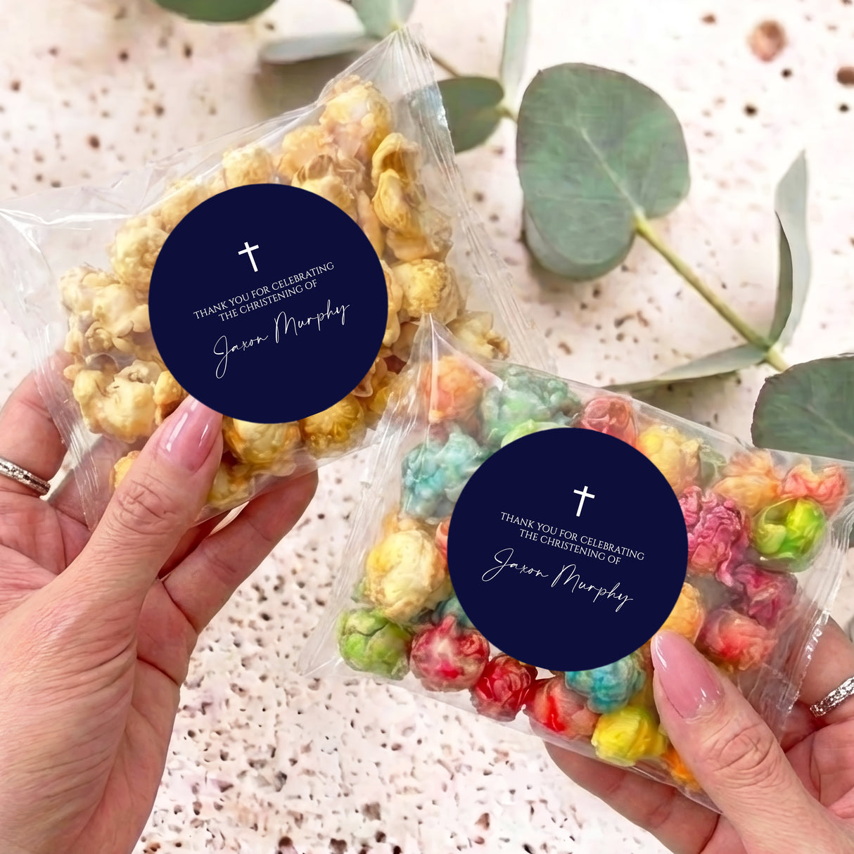 Christening popcorn bag with clear cellophane and navy label, cross and “Thank you” message