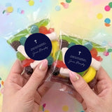 Two lolly bags with mixed sweets and navy round cross labels