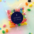 Jelly bean favour bag with multicolored sweets and navy circular label with white cross