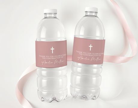 Personalised water bottle labels on clear bottles, dusty rose with white cross and text