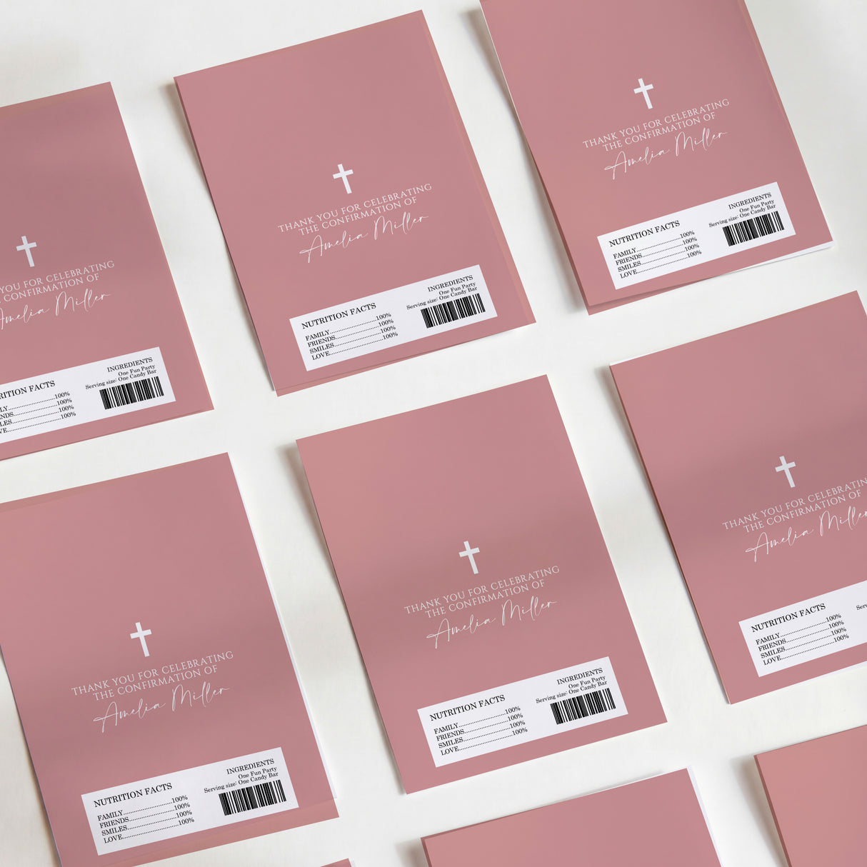 Dusty rose chocolate wrappers with cross and handwritten-style confirmation text