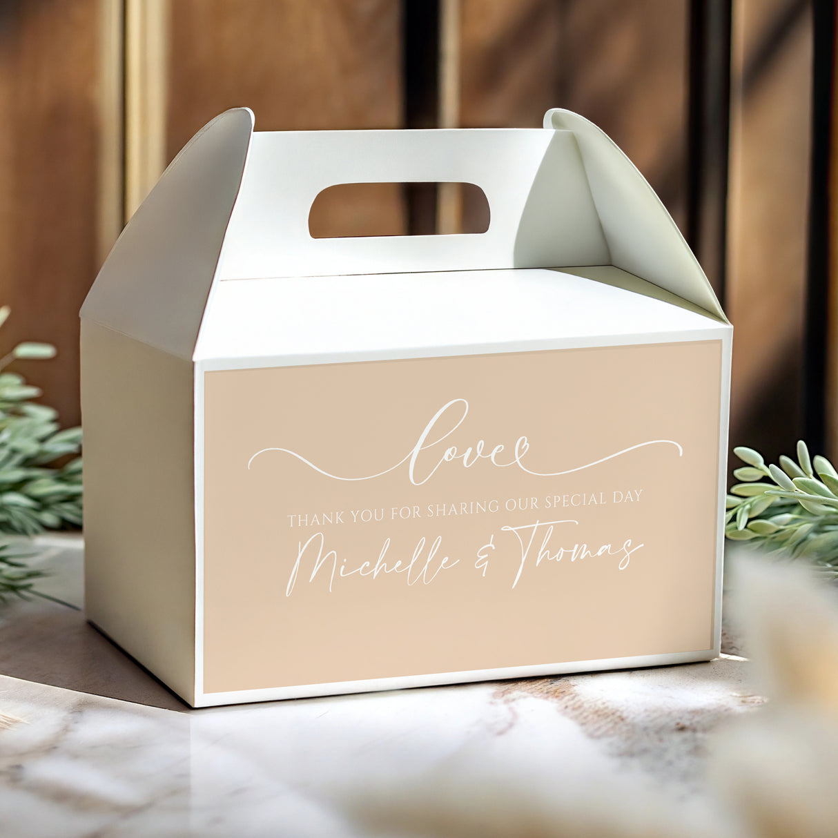 Beige wedding gable favour box with white handle and 'Love' script front