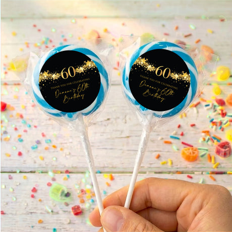 60th birthday personalized lollipops with black/gold '60' labels and blue ring wrappers