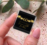 Black mini chocolate box with gold “60” and “Dianne’s 60th Birthday” star design