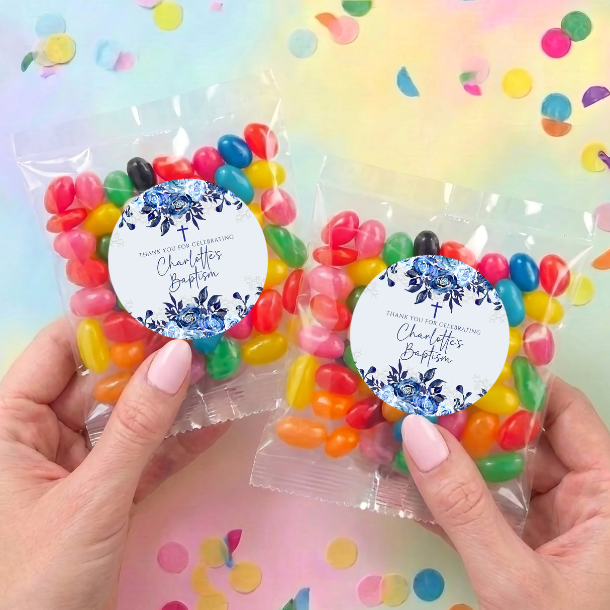 Two personalised jelly bean bags with navy floral round labels and clear pouches of colorful beans